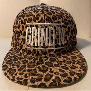 Cheetah/Leopard print cap/hat with the word GRIND’N on the front. Adjustable.